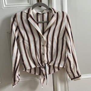 Women’s button down blouse with front tie.